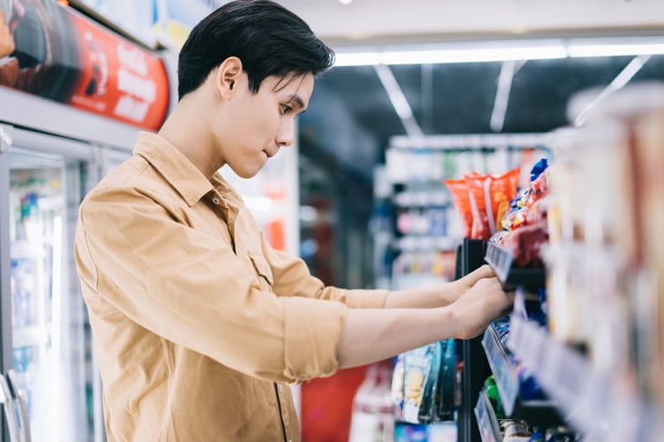 Young man in a convenience store