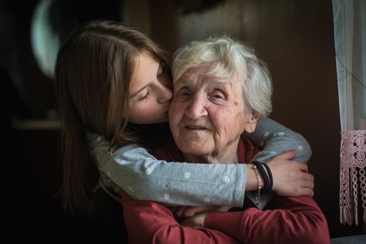 Kid hugging her grandma