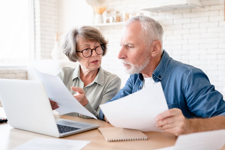 Older couple reviewing their finances.