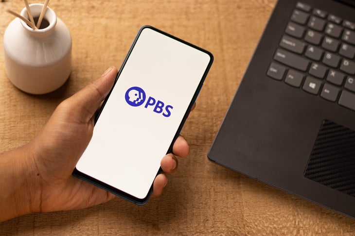 PBS TV app logo on a smartphone