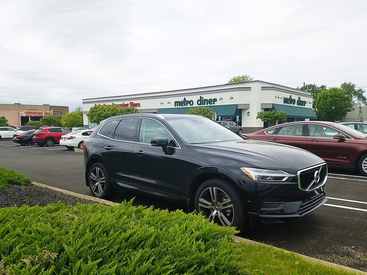 A 2019 Volvo XC60 parked near a Metro Diner