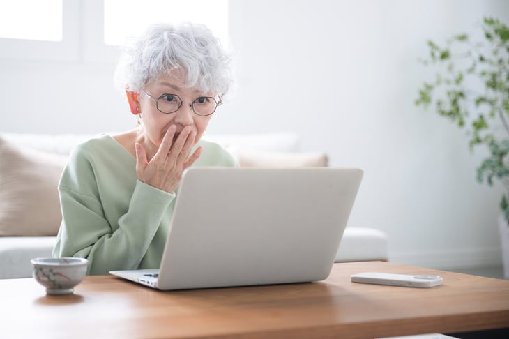 Senior woman falling victim to a scam