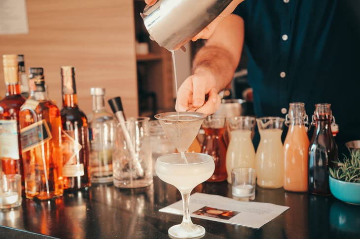 Man making drinks.