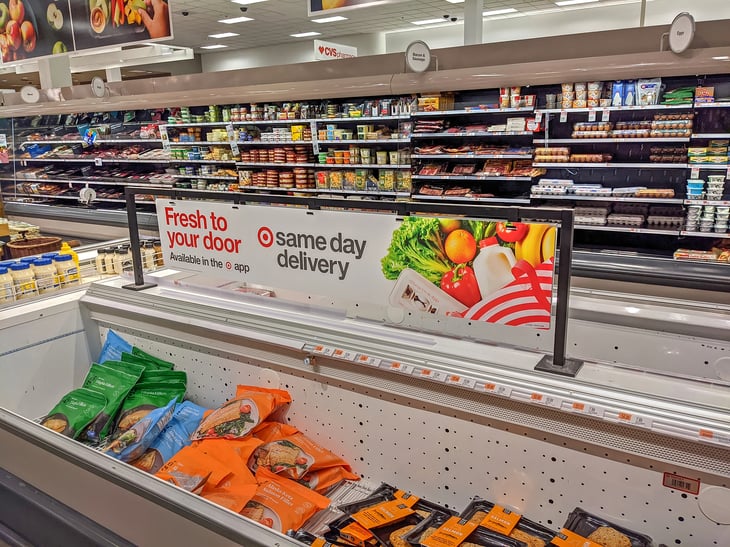Sign advertising same day delivery in the grocery section of a Target store