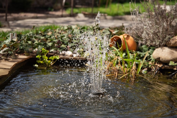 Water feature fountain in garden.