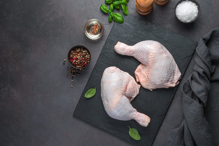 Two chicken thighs, pepper, spices and oil
