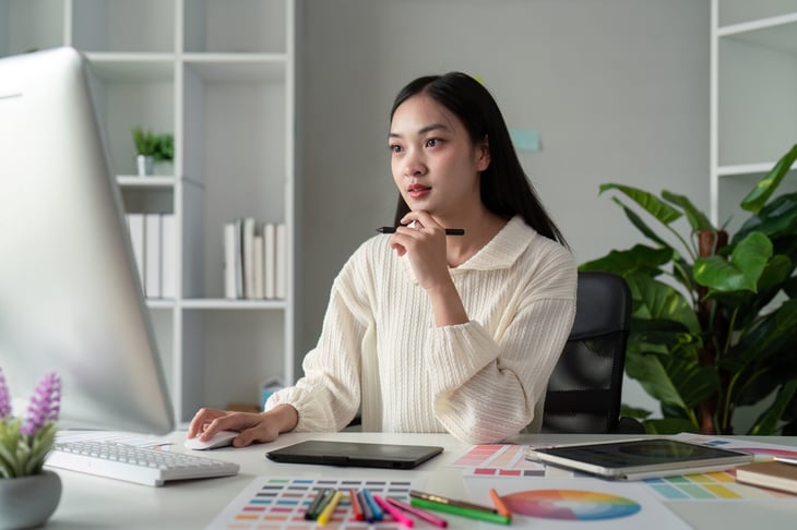 Graphic designer working in her home office.