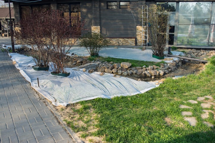 Grass covered with white burlap