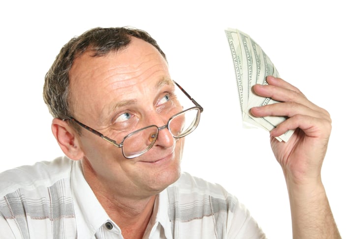 Senior man holding money