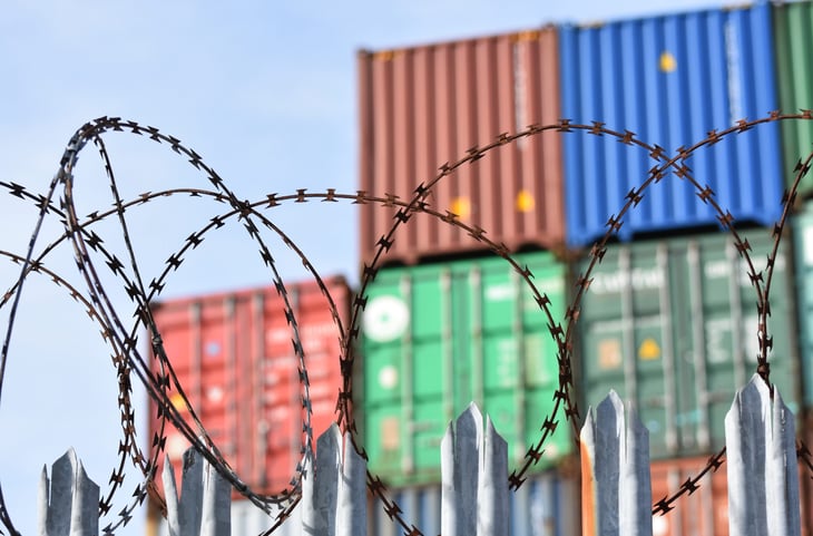 Shipping containers with barbed wire