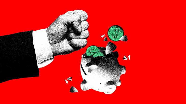 Man smashing piggy bank