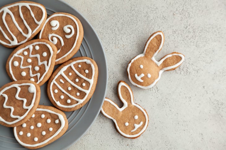 Cookies shaped and decorated like eggs and bunny heads for Easter