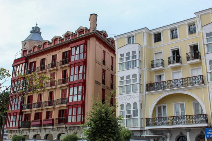 Traditional facade with closed balconies in Castro Urdiales, Spain
