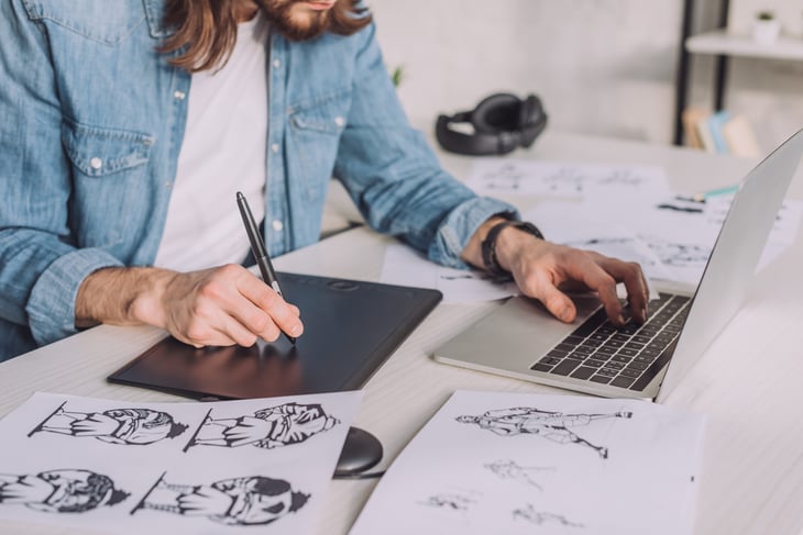 Digital illustrator using tablet and stylus