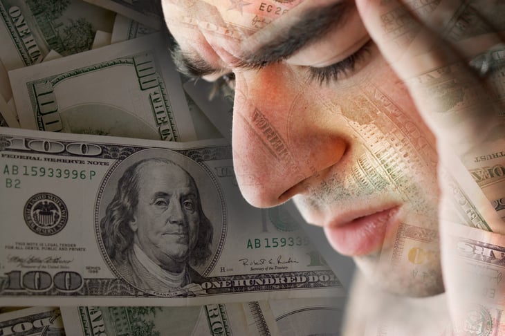 Worried man with money in the background