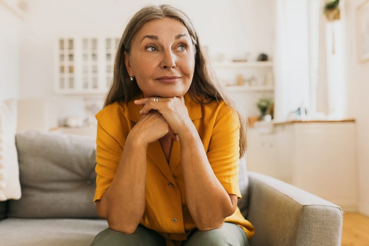 Senior woman on her couch at home