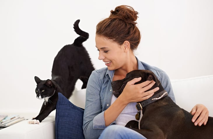 Woman with her dog and cat