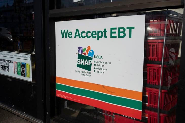 "We Accept EBT" sign is seen at the entrance to a 7-Eleven store in Oregon City, Oregon. The Supplemental Nutrition Assistance Program (SNAP) is a federal program.