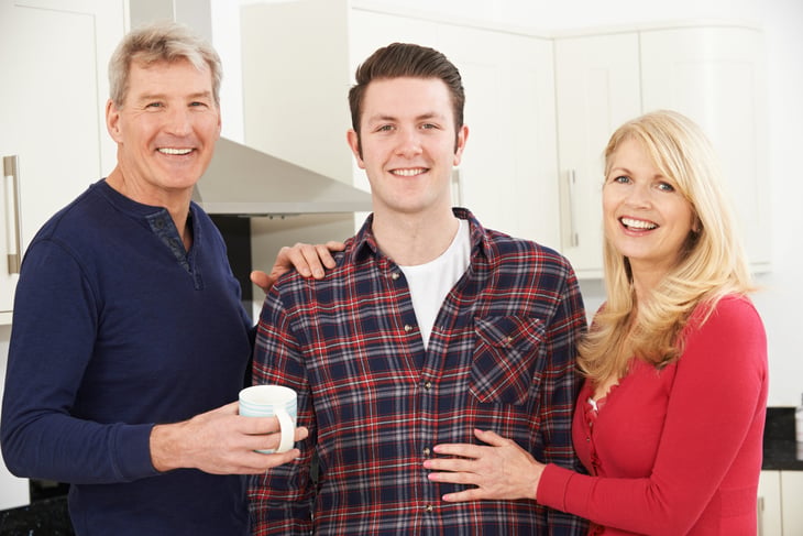 Happy parents with their adult son