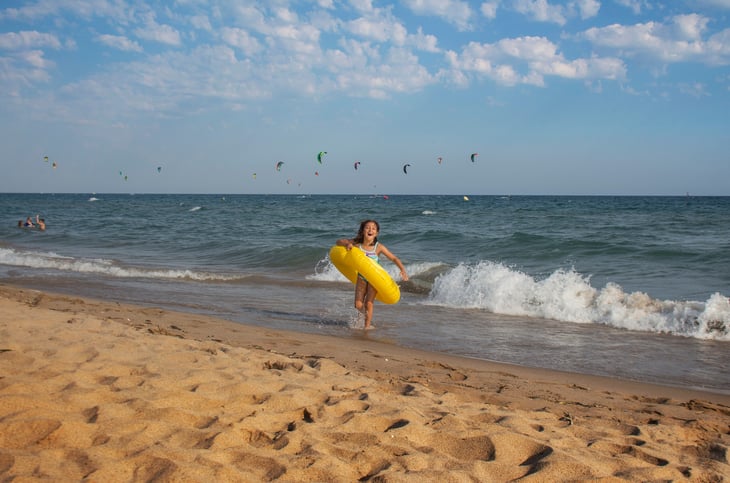 Child swimming at the Castelldefels Beach is Spain