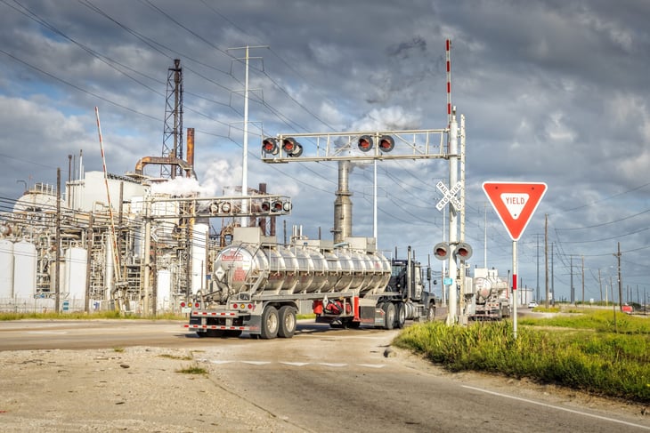 Oil industry plant and semi trucks in Port Arthur, Texas