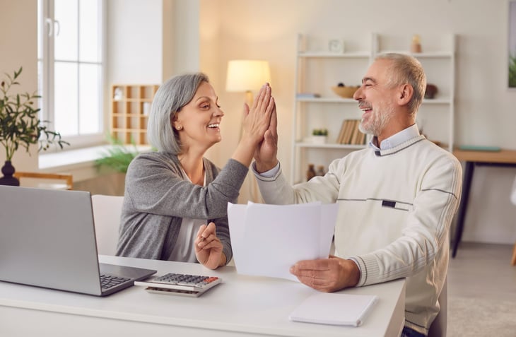 Happy homeowner couple who cut their tax bill