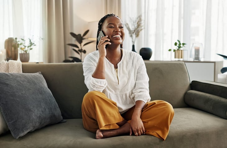 Woman happy talking on the phone.