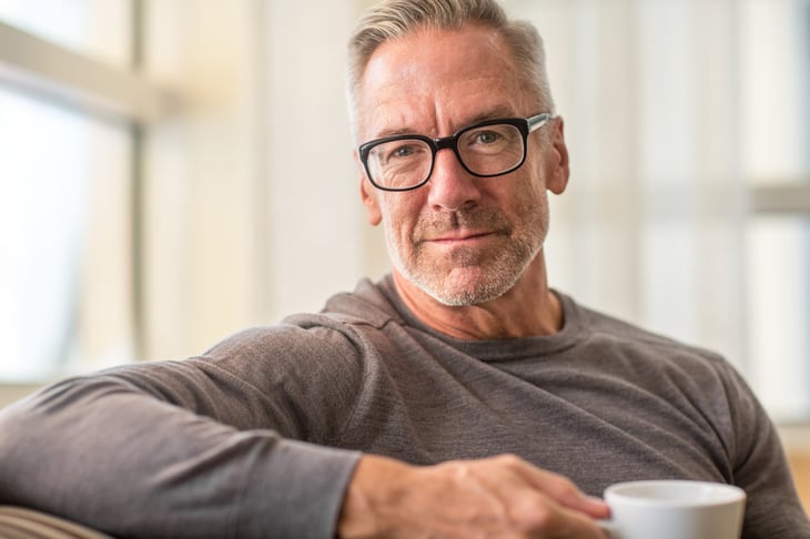 Older man drinking coffee