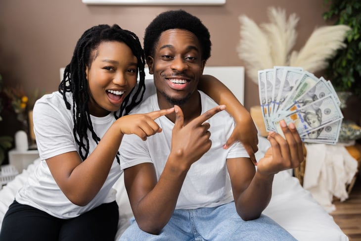Young couple with money