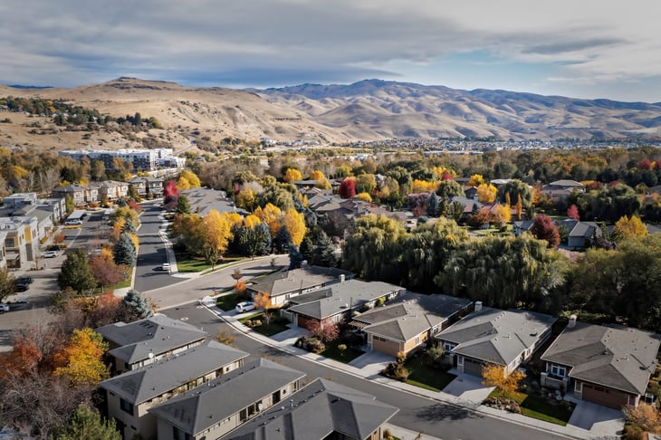 Multifamily residential apartment buildings and single family home with fall colors in Boise, Idaho