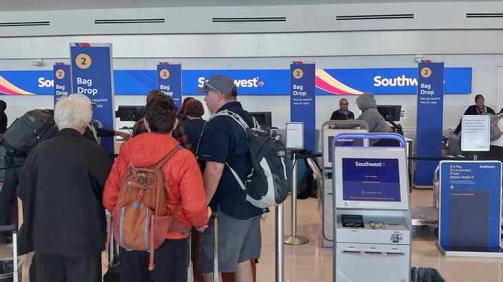 Passengers in line at a Southwest Airlines airport counter