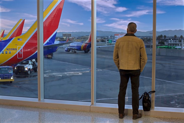 Traveler watching Southwest Airlines airplanes at Los Angeles International Airport