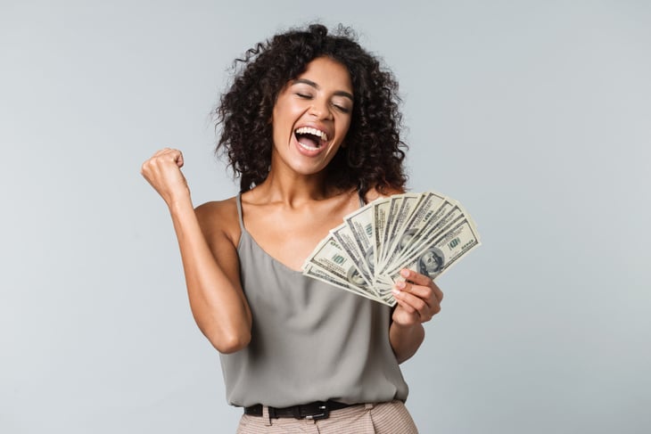 Happy woman holding money