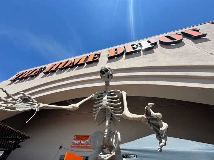 An Ultra Skelly skeleton Halloween animated decoration, outside of a Home Depot store.