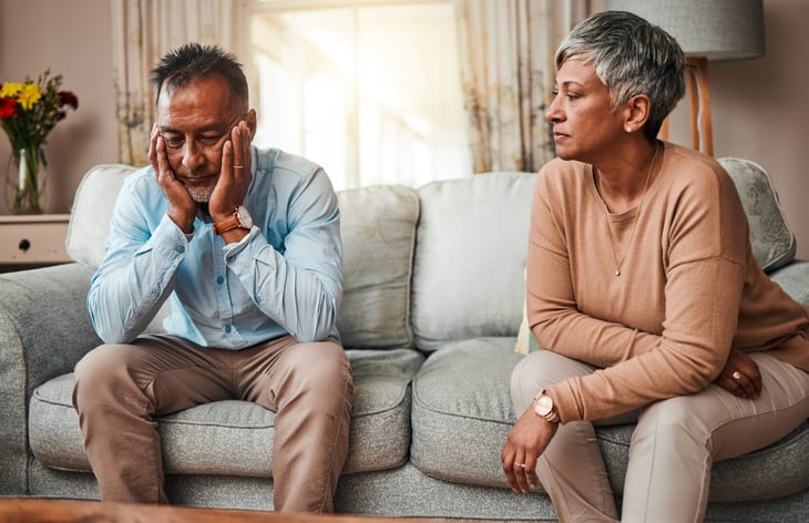 Older couple at home, fighting and unhappy.