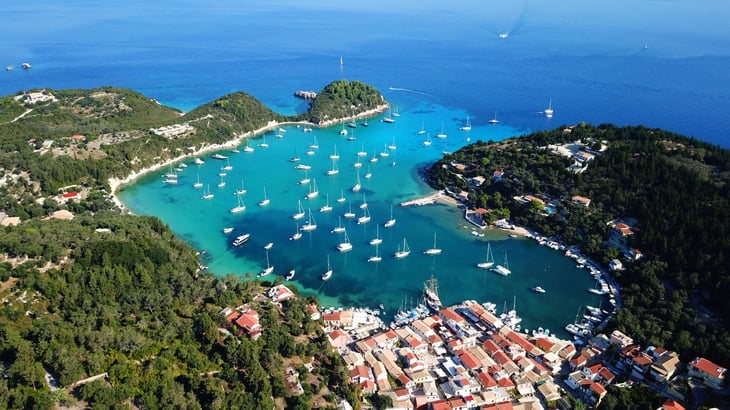 small port and fishing village of Lakka with sail boats, Paxos, Greece