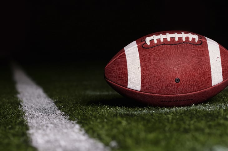 Closeup of football on turf