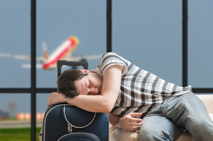 Man sleeps in an airport