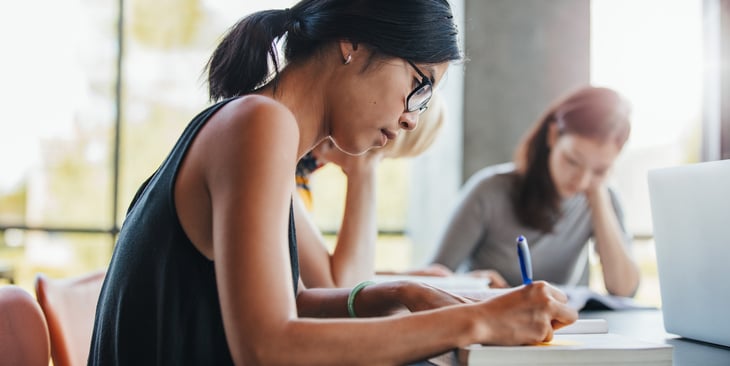A college student takes notes