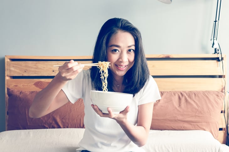 Woman eating noodles