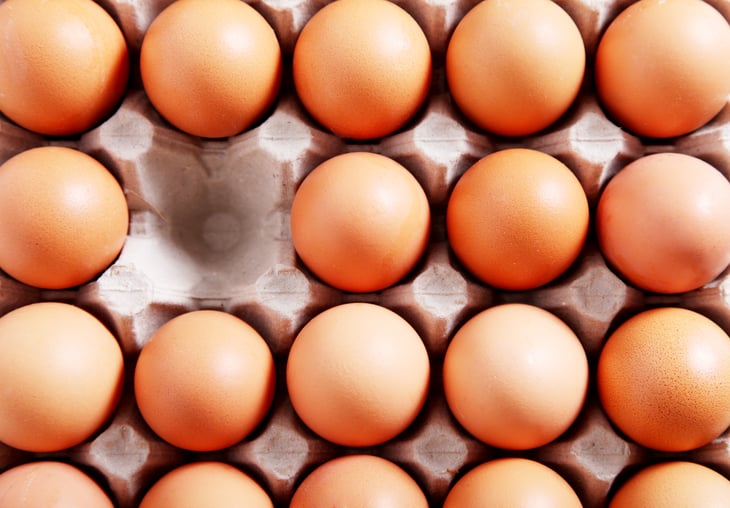 Egg carton with one egg missing
