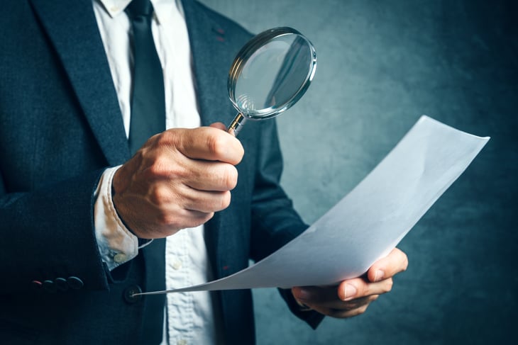 An investigator with a magnifying glass