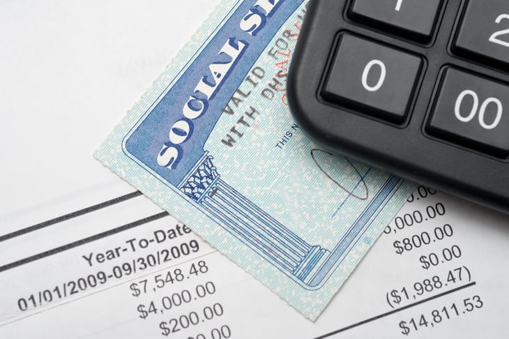 Social security card with a fee schedule and a calculator